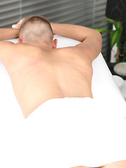 Kirk James lies relaxed as Sebastian massages his cock