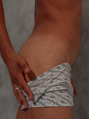 Skinny twink Jon bares the meaty love rod hiding under his baggy boxers