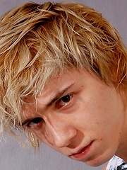 Cute blonde teen boy exposes his slim body